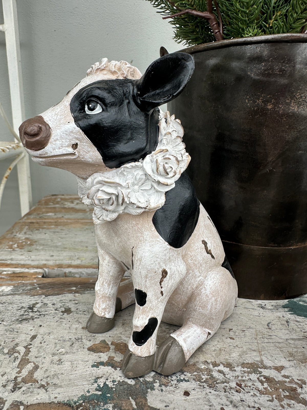 Cow with floral wreath