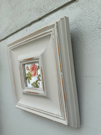 Floral picture in chunky grey frame