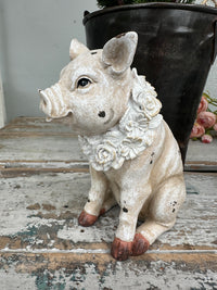 Pig with floral wreath