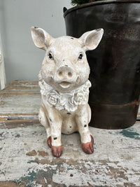 Pig with floral wreath