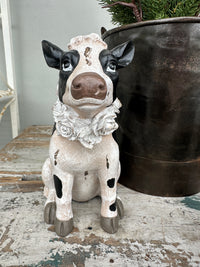 Cow with floral wreath