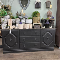 This old sideboard was covered in paint sploshes as it has been used in our classroom for the last few years as storage. Time to pull her out and spruce her up. She looks very rustic elegant now and still has great storage potential!