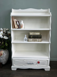 Red Roses and White Bookshelf display