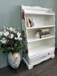 Red Roses and White Bookshelf display